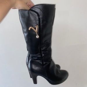 Chunky leather knee high boots with heels